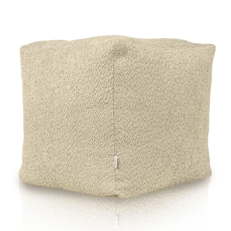 Weicher beiger Sitzpouf mit Boucle-Textur für gemütliche Räume