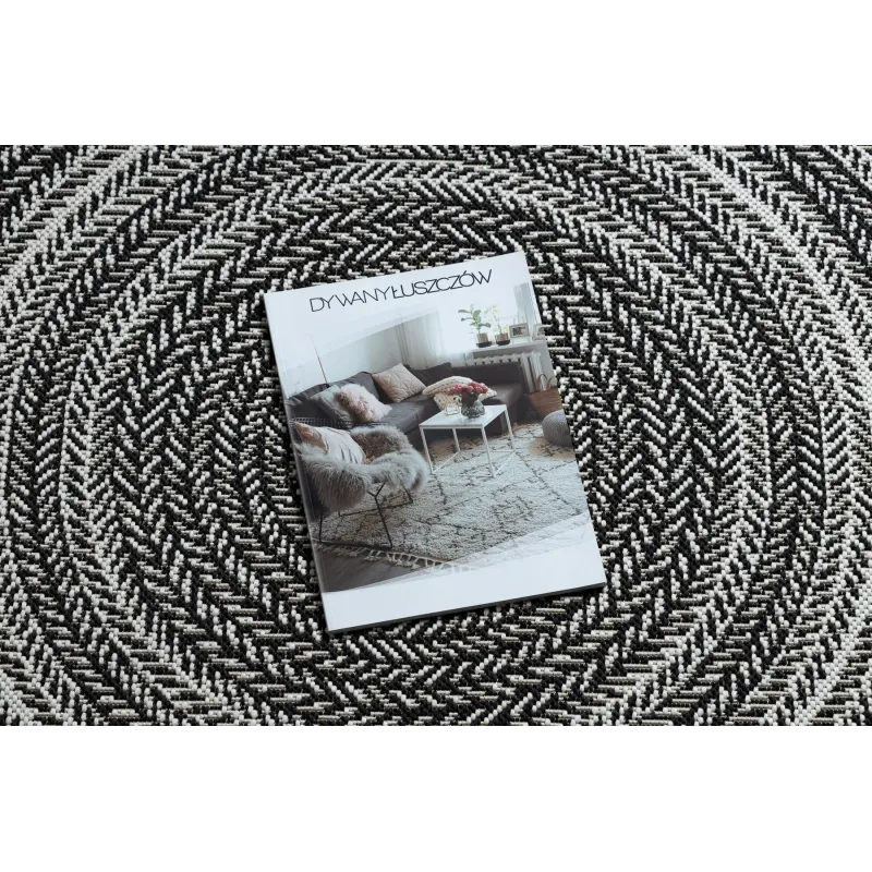 Schwarzer runder Teppich im Boho-Stil, perfekt für das Wohnzimmer