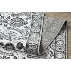 Strukturierter Teppich in Grau mit Blumen für das Schlafzimmer
