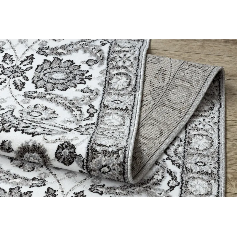 Strukturierter Teppich in Grau mit Blumen für das Schlafzimmer