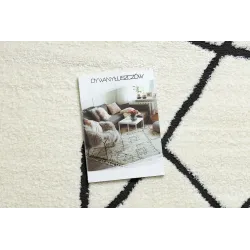 Abstrakter Teppich in creme und schwarz, ideal für moderne Wohnräume