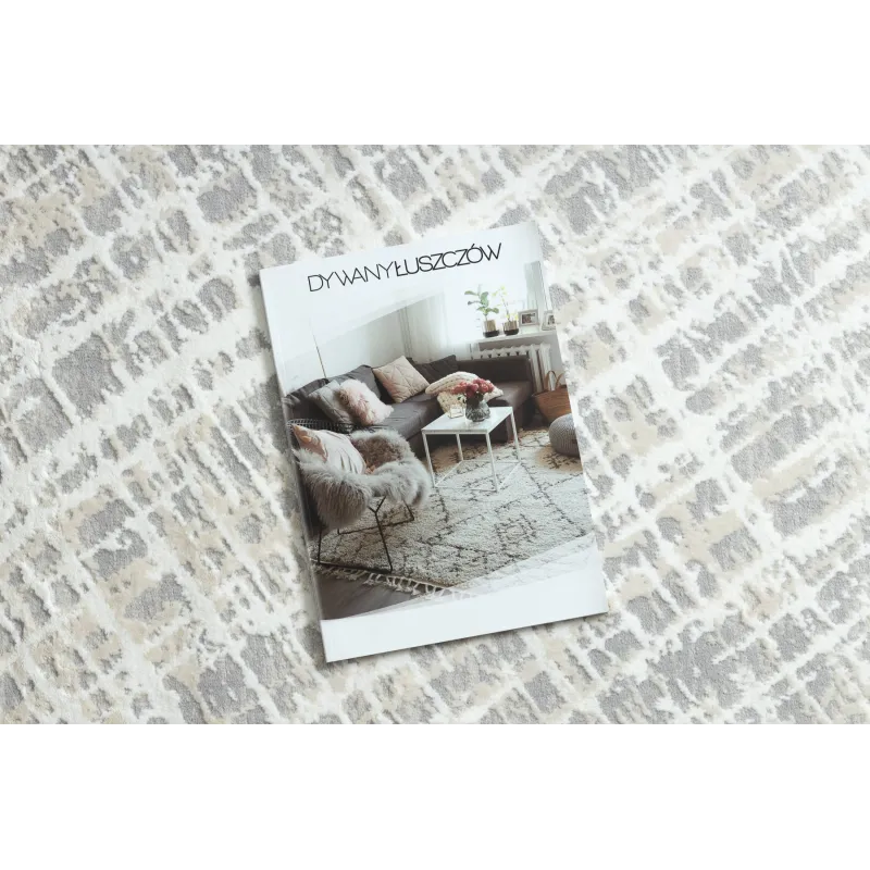 Eleganter Teppich in creme und grau, ideal für moderne Wohnräume