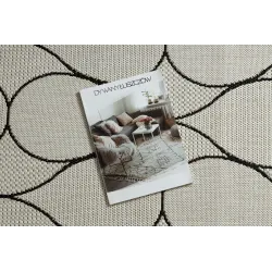 Eleganter Teppich in Creme und Schwarz, ideal für das Wohnzimmer